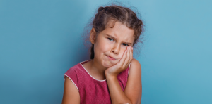 little girl with toothache