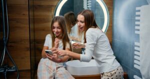 teen girls brushing teeth