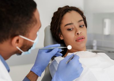 Scared,Black,Woman,Looking,With,Fear,At,Dental,Tools,In