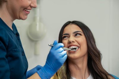 woman with braces at dental checkup