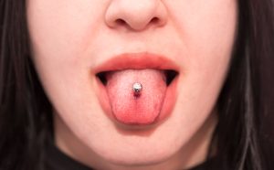 woman with tongue piercing