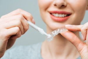 applying whitening product to tray