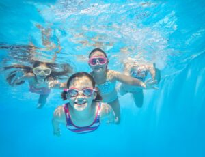 kids swimming underwater