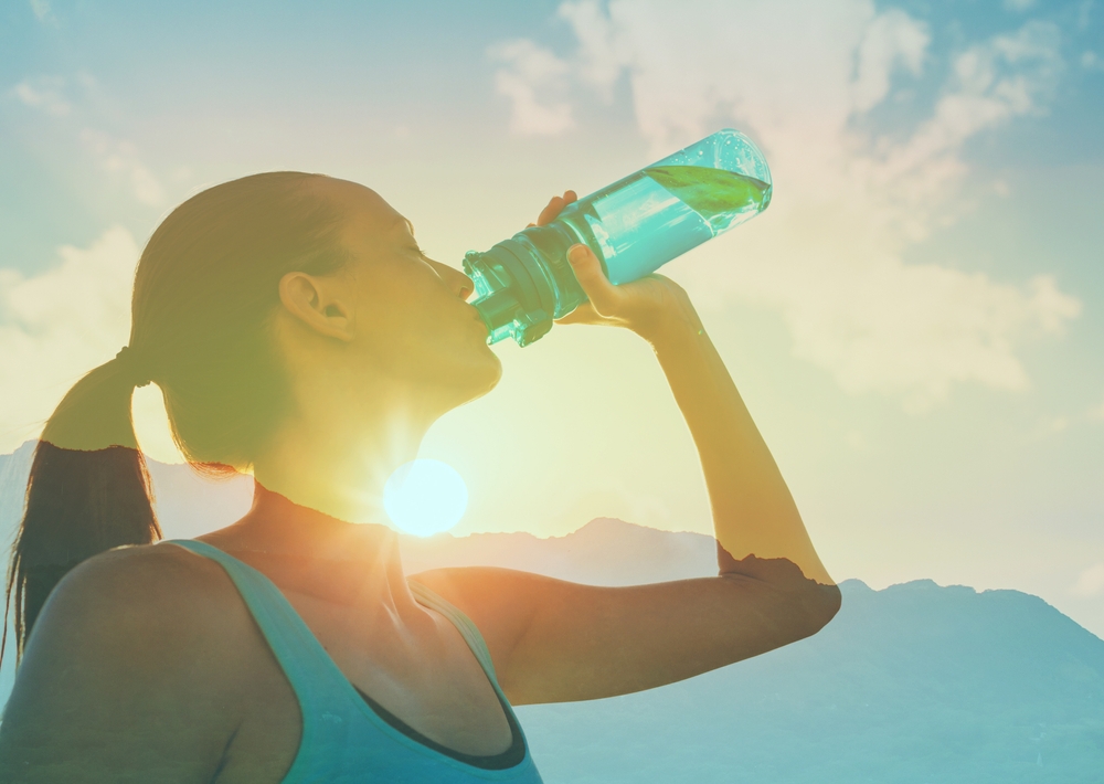 active woman drinking water