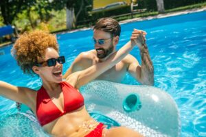 man and woman enjoying pool